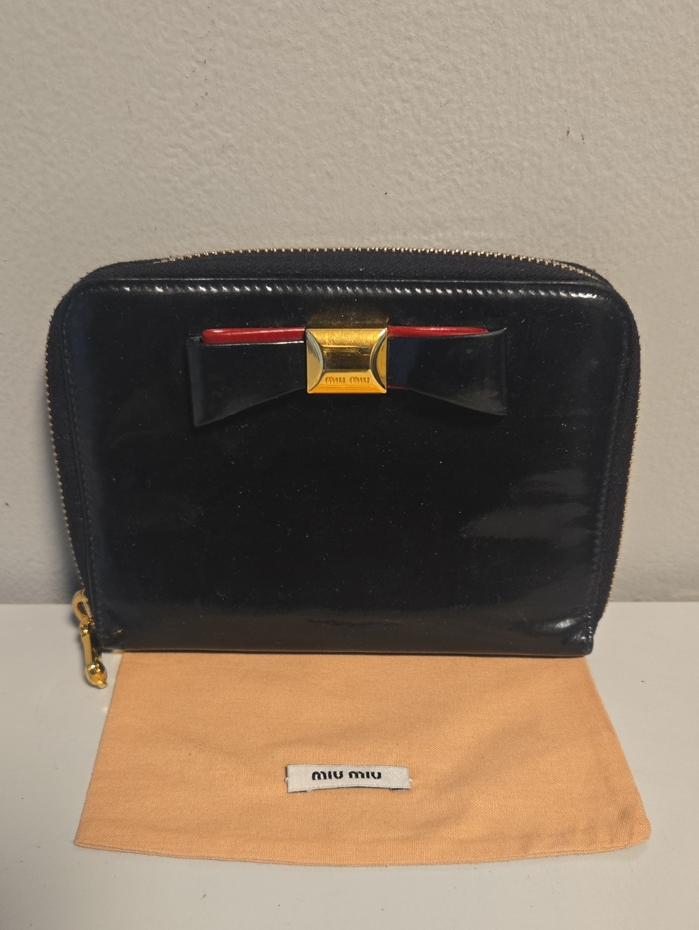 Miu Miu Black Patent Leather Zip Agenda with Red Trim and Gold Bow